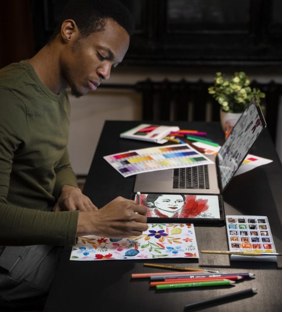 side-view-man-drawing-tablet